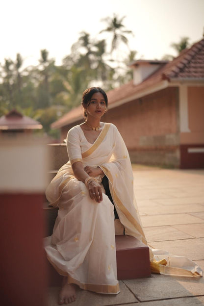 Kasavu saree in daisy embroidery
