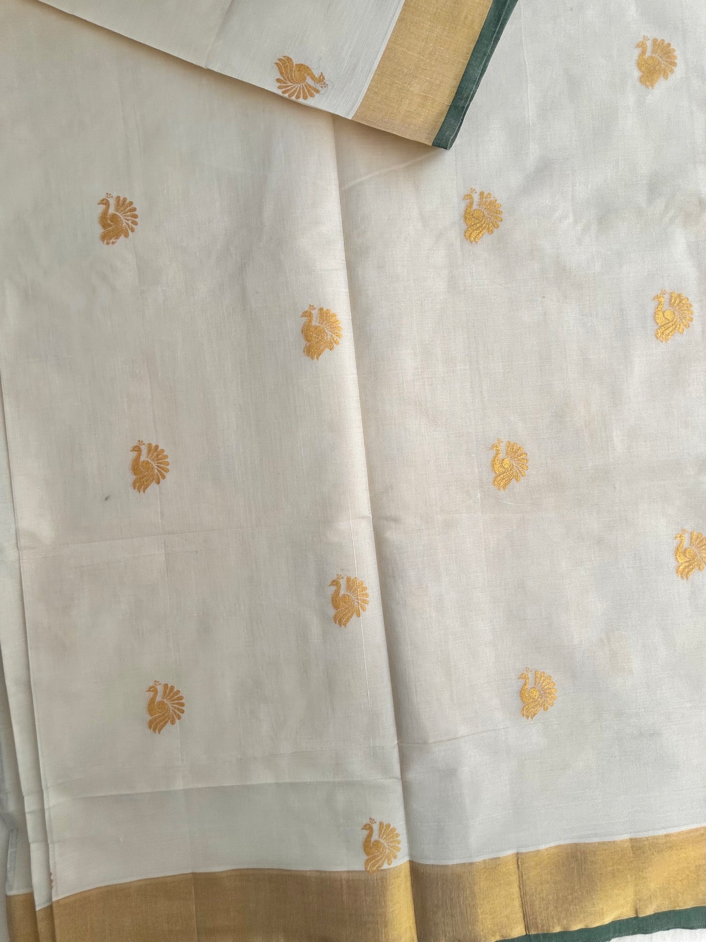 Kasavu saree in peacock print with green border