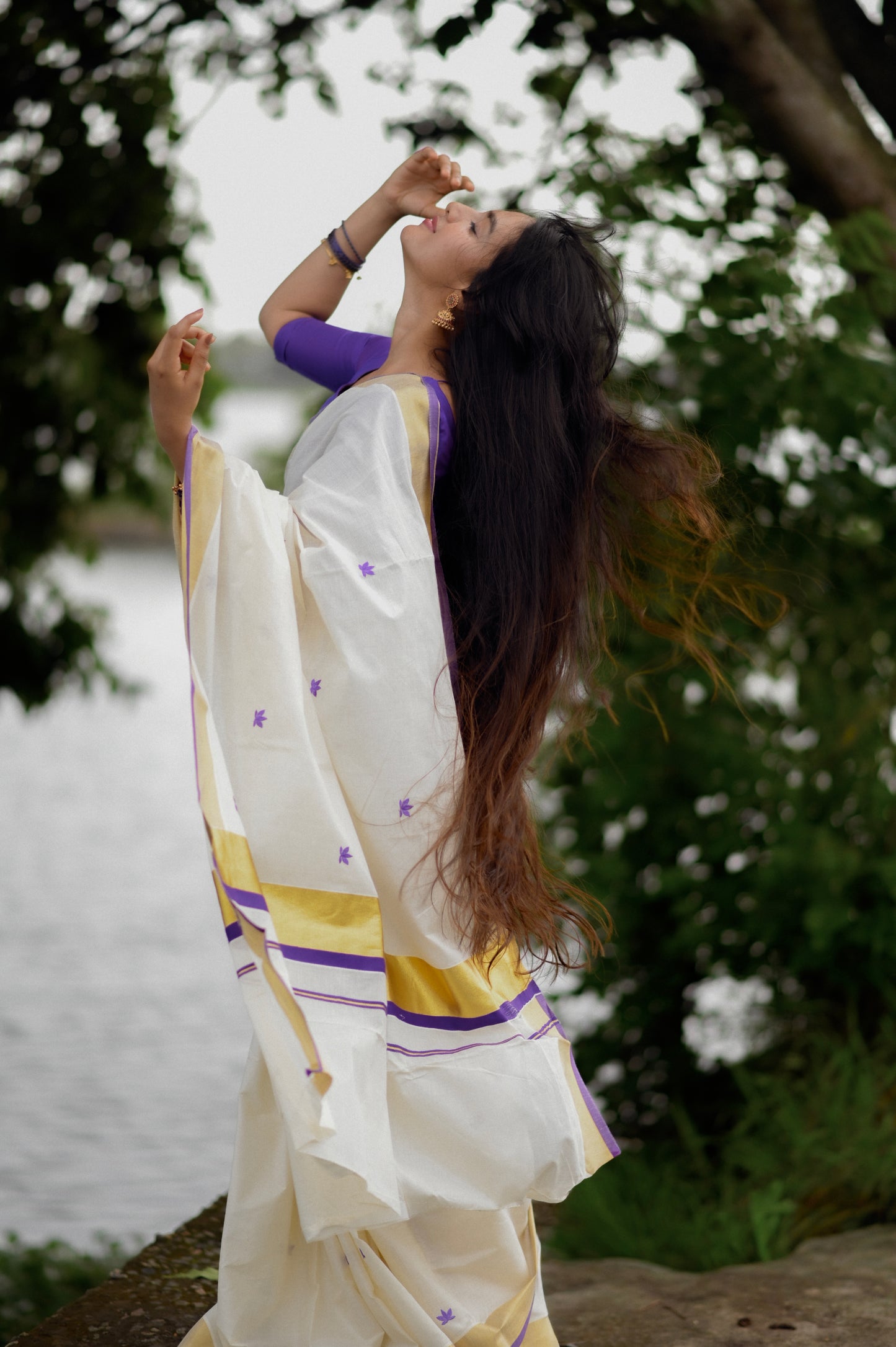 Kasavu saree in lotus embroidery - Russian violet