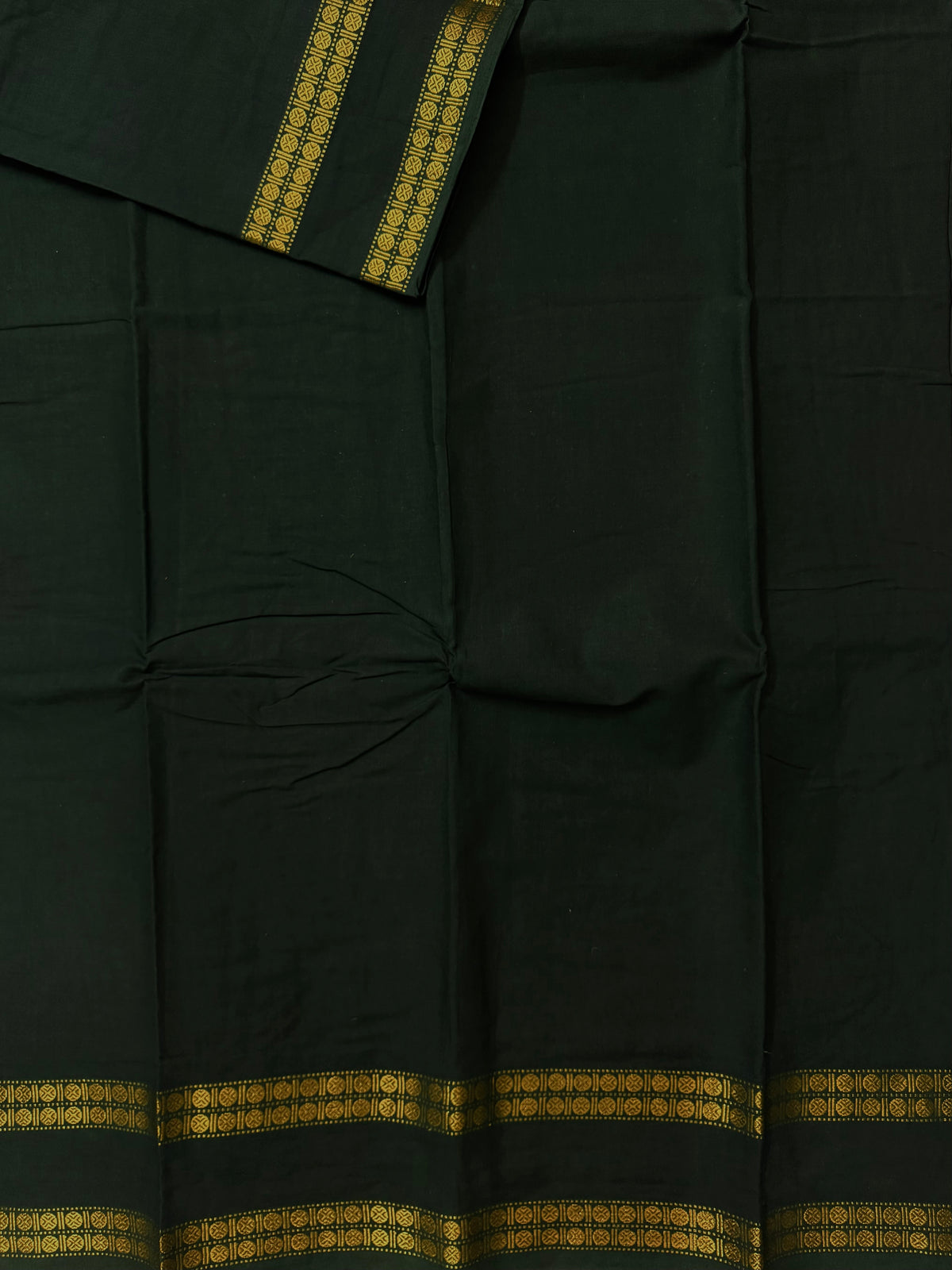 Sungudi saree with minimal zari border dark green