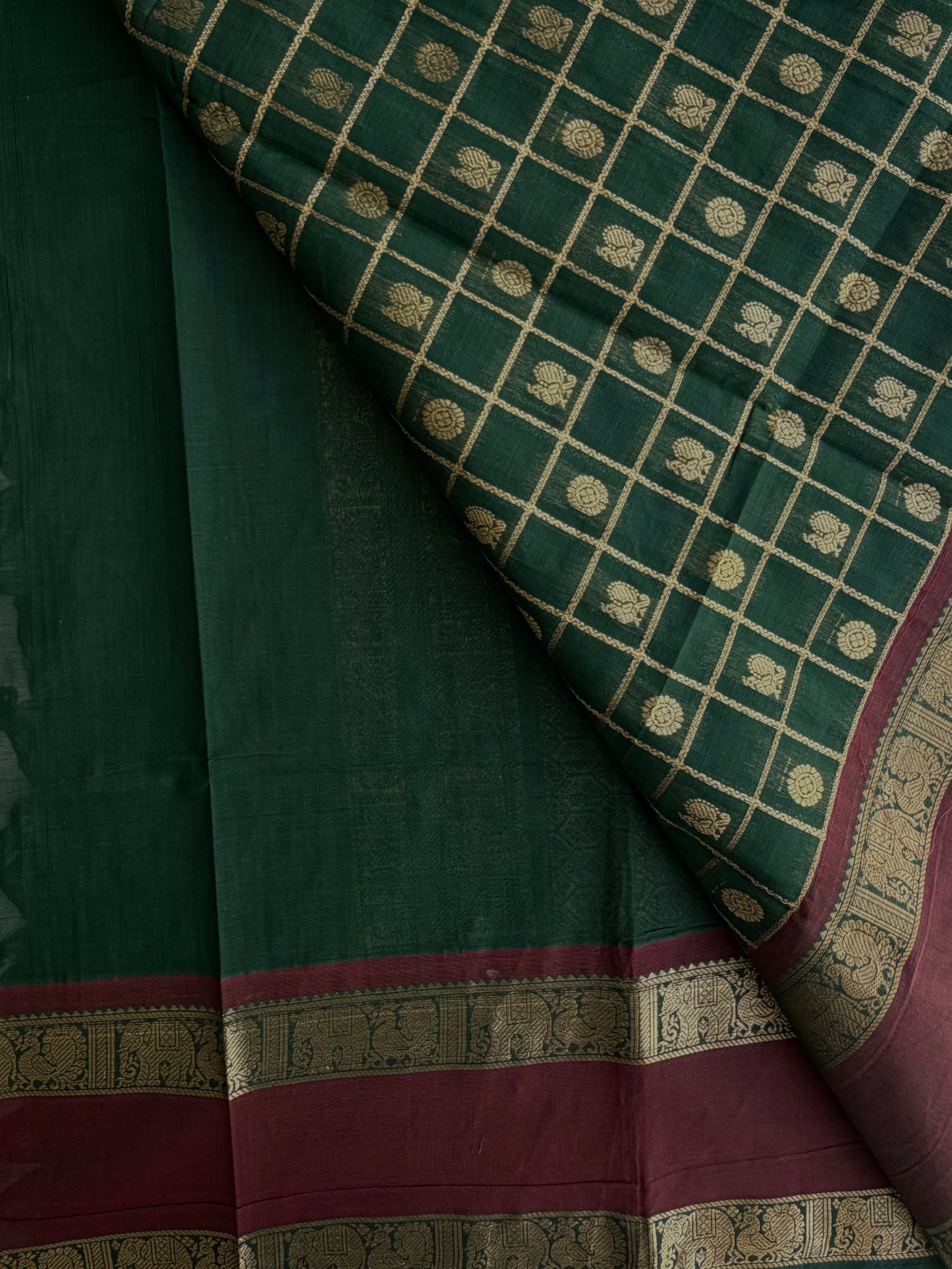 Kanchi cotton saree with checks & butta weaves with a grand pallu - green