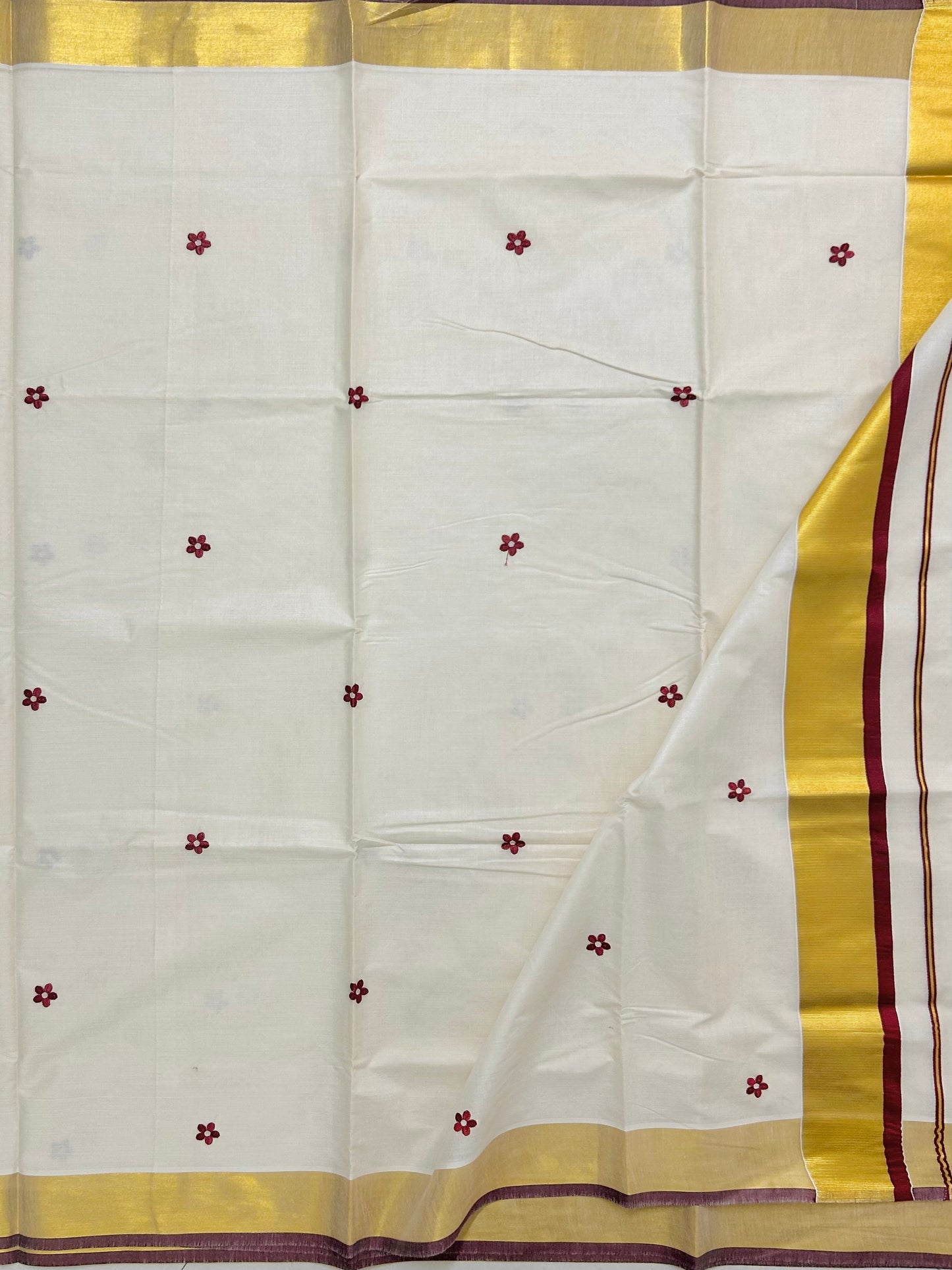 Kasavu saree in floral embroidery - maroon