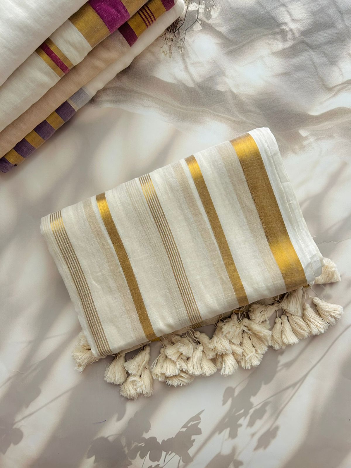 Off white Mul mul saree with zari stripes