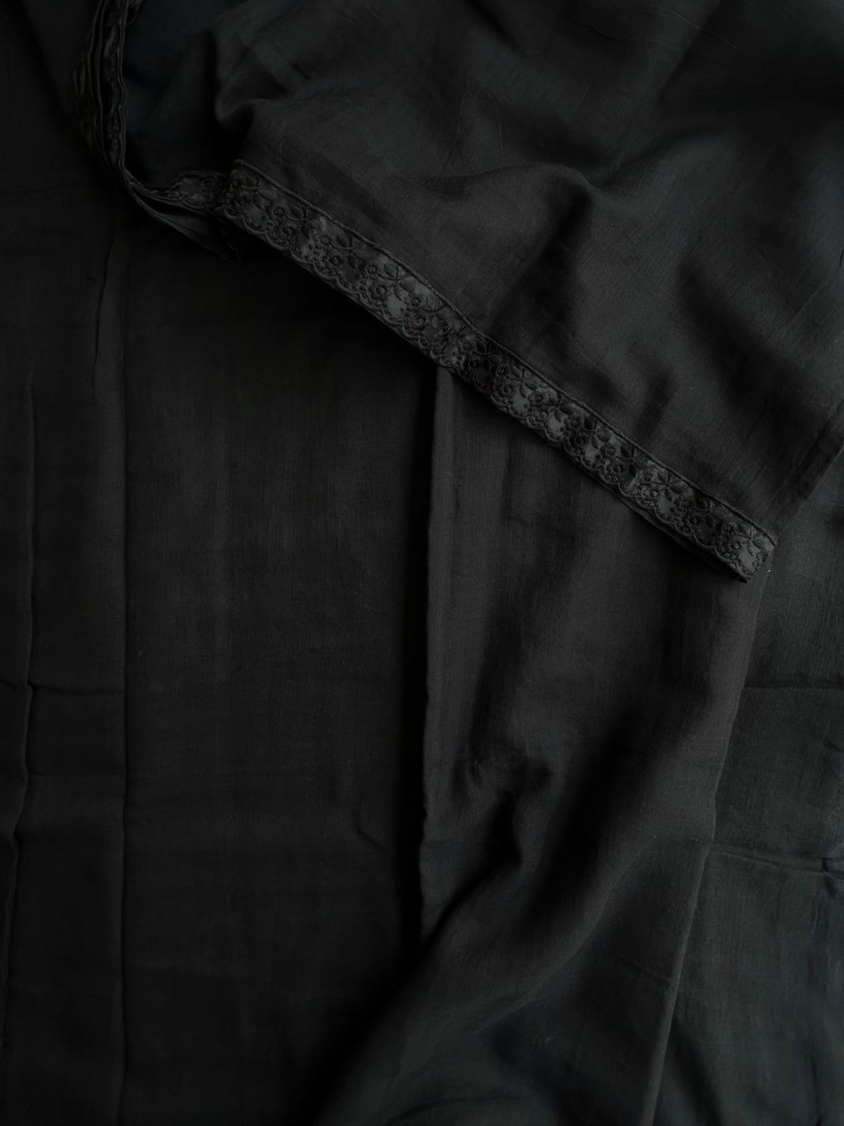 Plain black mul cotton saree with lace border